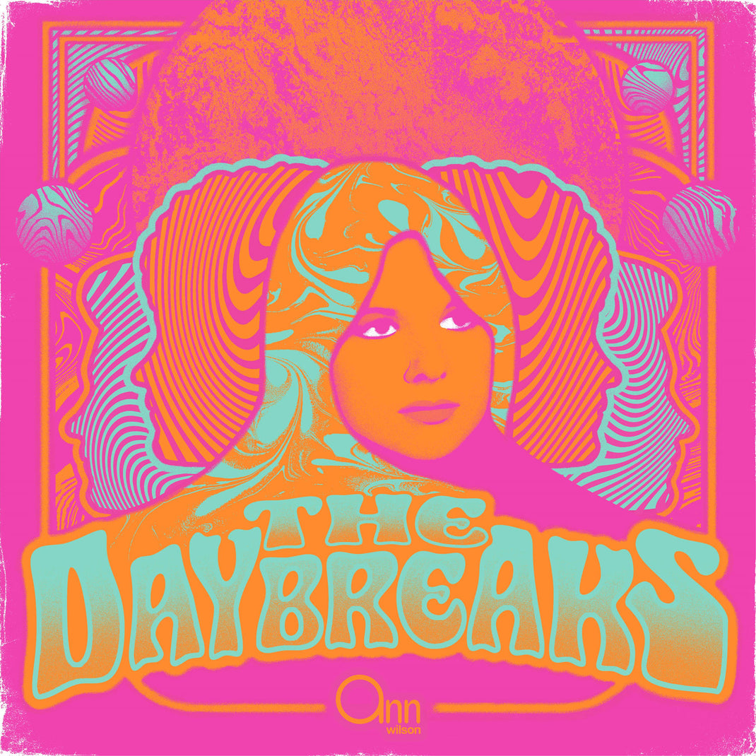 Album cover for 'The Daybreaks' with a stylized face and vibrant colors on a pink background.