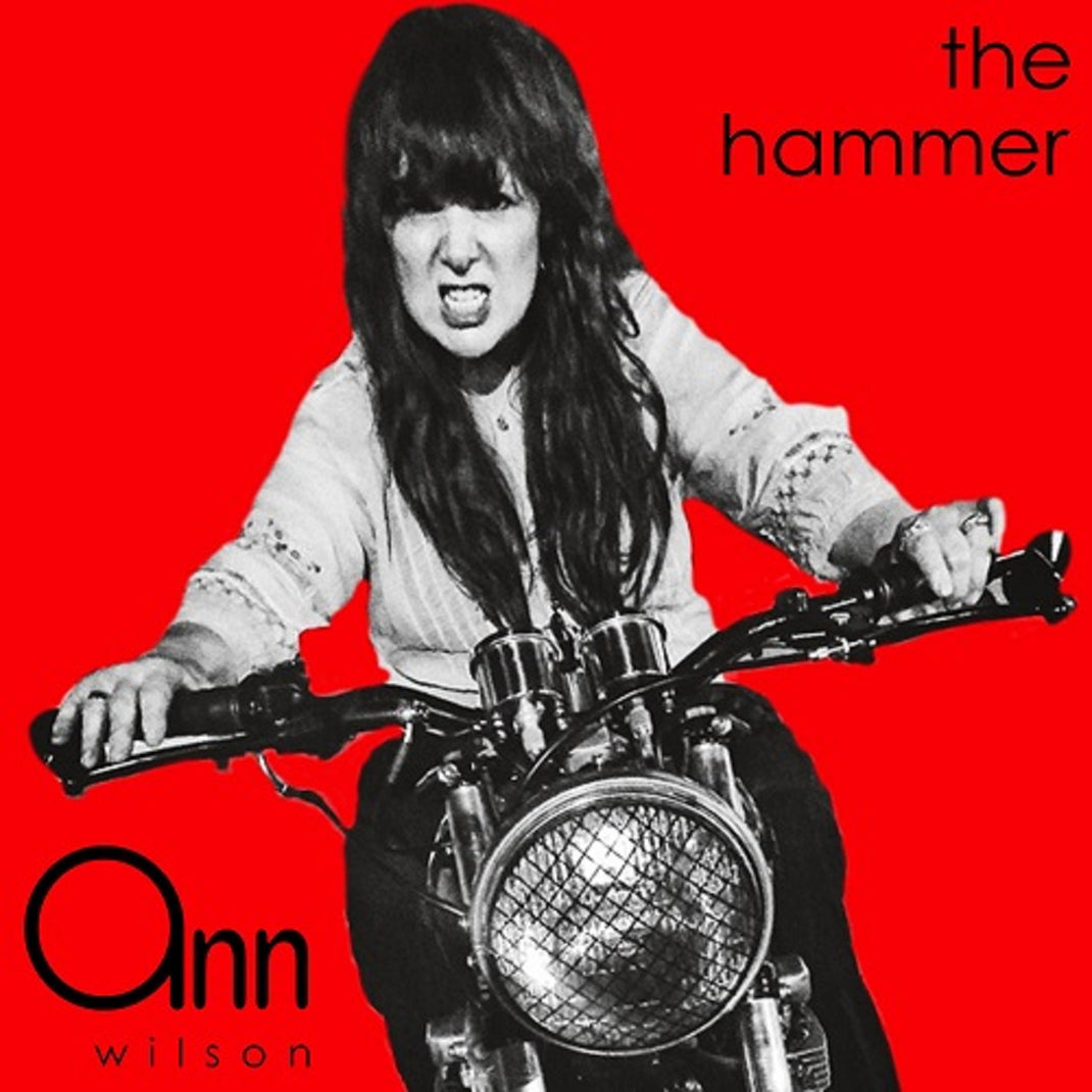 Album cover with a person on a motorcycle against a red background, featuring the text 'the hammer' and 'Ann Wilson'.